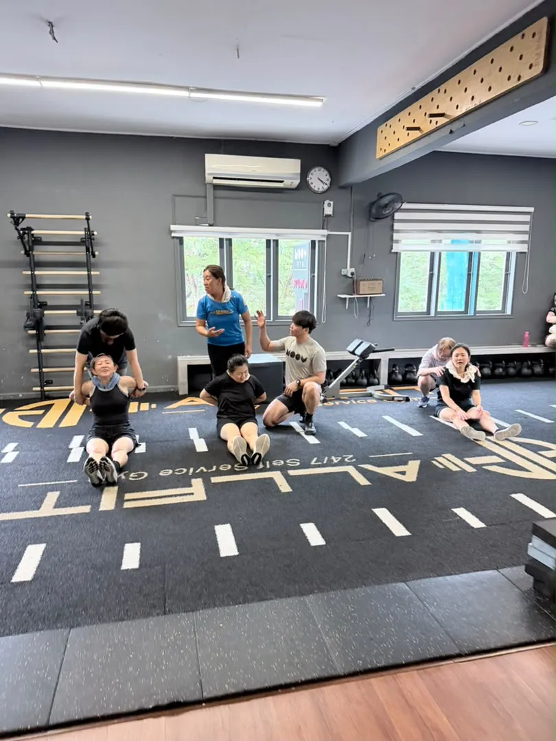 Participants practising floor exercises with guidance in Moov Studio 1