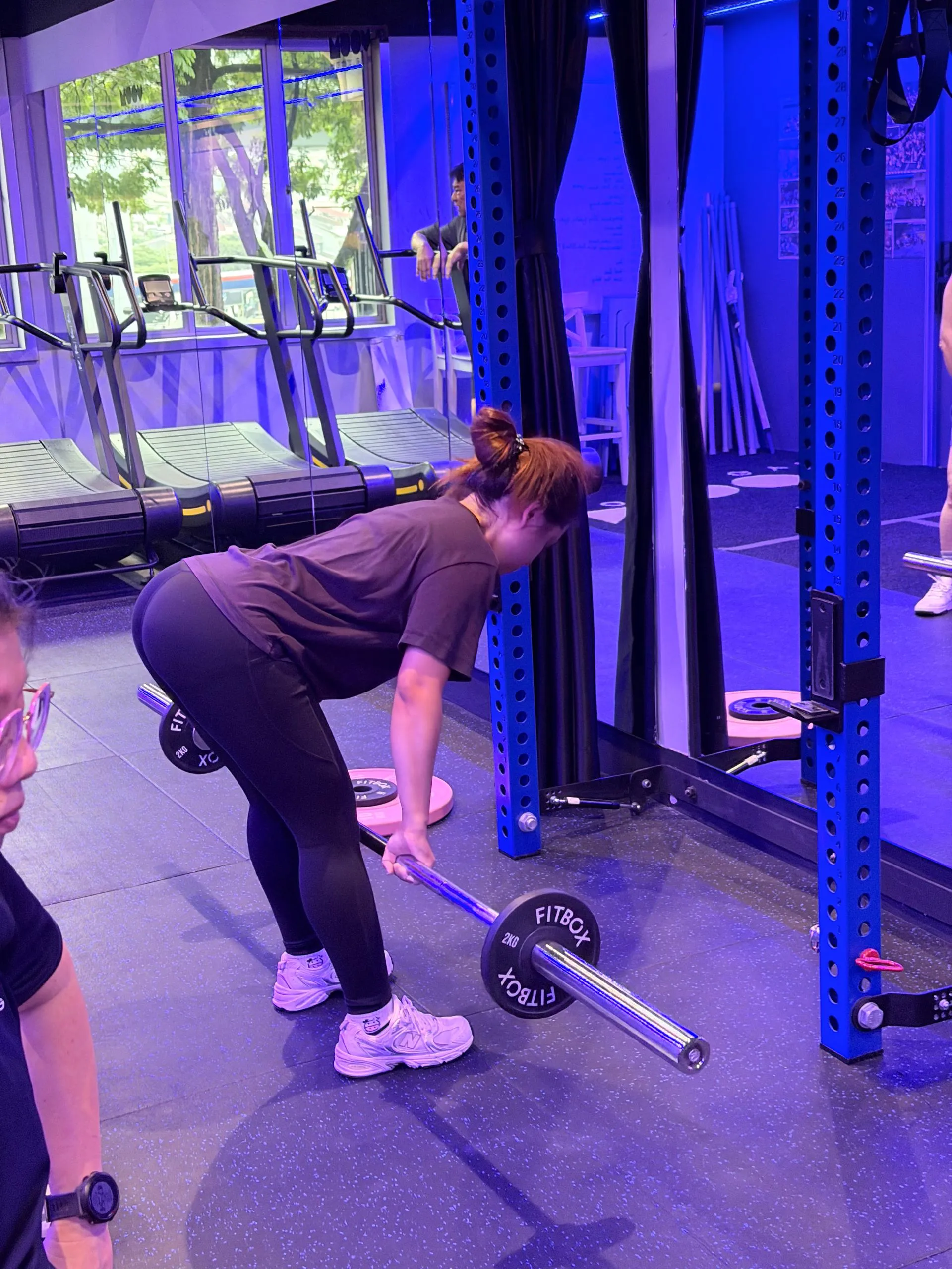 Barbell training beside the blue racks in Moov Studio 2